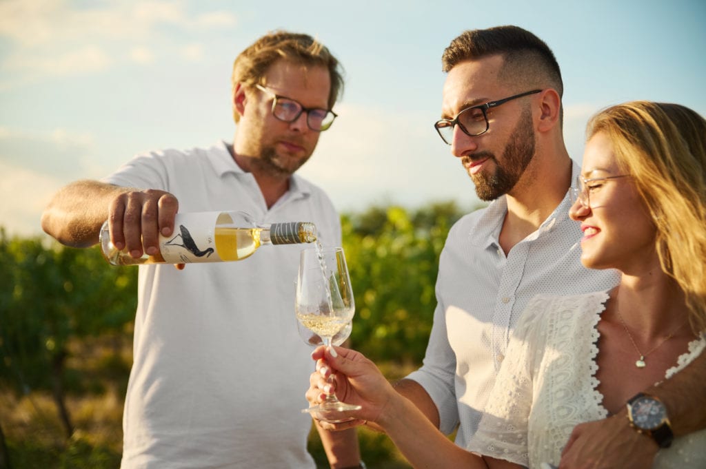 a man holding a glass of wine